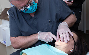 Dr. Berg helping a patient